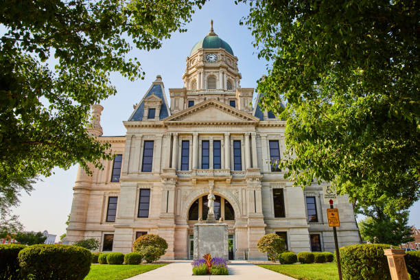 istock Statue in front of courthouse with flowers and front entrance view 1746754140