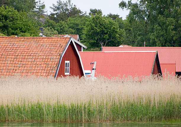 Swedish fishing village Red roofs of houses in a Swedish fishing village near the Baltic Sea. ostergotland stock pictures, royalty-free photos & images