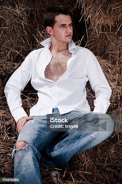 Portrait Of A Young Man In Field Stock Photo - Download Image Now - Adult, Adults Only, Beautiful People