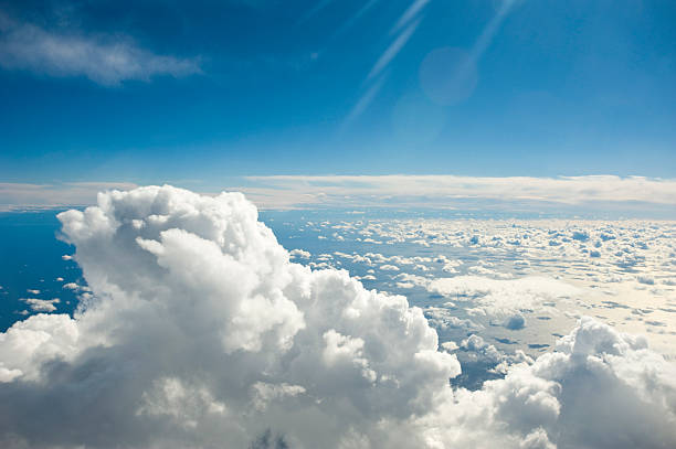 istock Clouds over the ocean in a blue sky 174676626