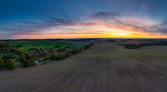Autumnal landscape of Kashubian fields at sunset. Poland