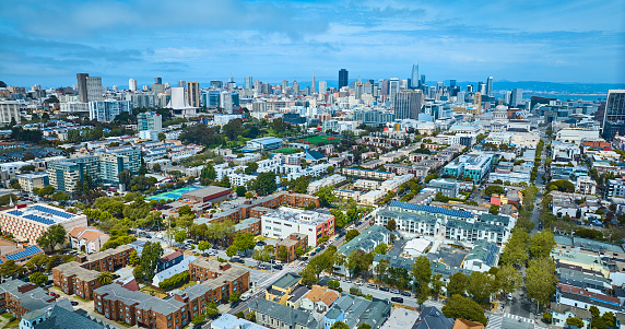 Image of Wide Aerial of San Francisco city skyscraper skyline under pretty blue sky