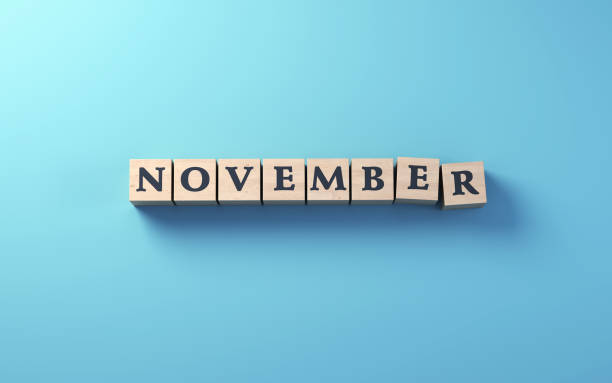 istock November Written on Wooden Blocks Standing on Blue Background 1746772392