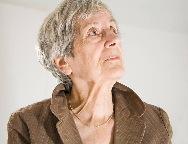 istock Senior Woman Looking Up 174677312
