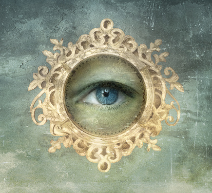 Beautiful image representing an eye framed by a golden frame in baroque style