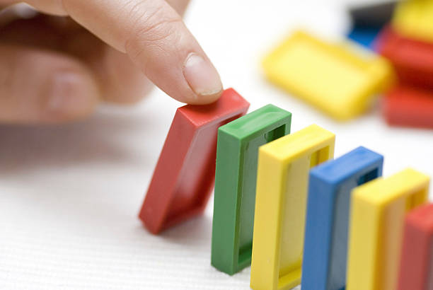 istock domino tiles and hand 174678184