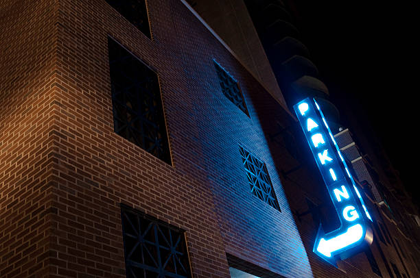 istock Neon Parking Sign at Night 174678298
