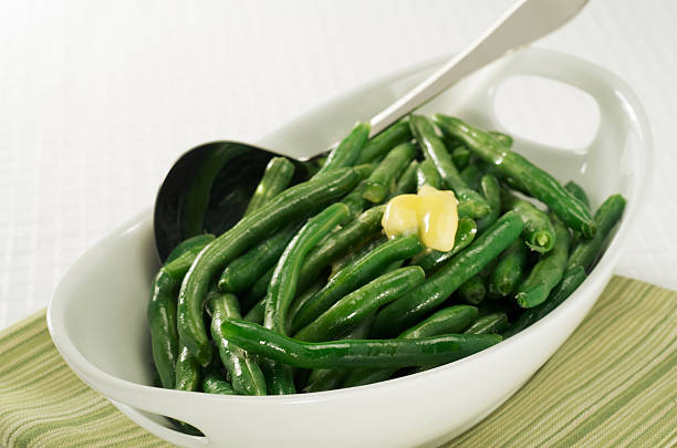 istock Healthy, steamed green beans with butter in a white bowl 174678708