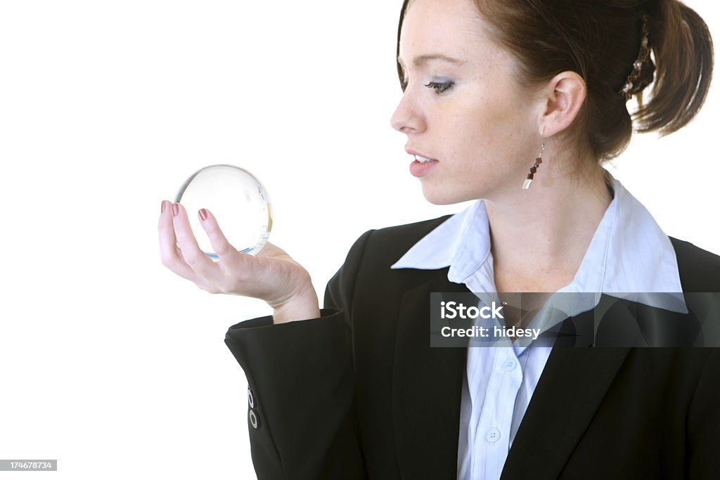 Business woman gazing into crystal ball Business woman gazing into crystal ball. Adult Stock Photo