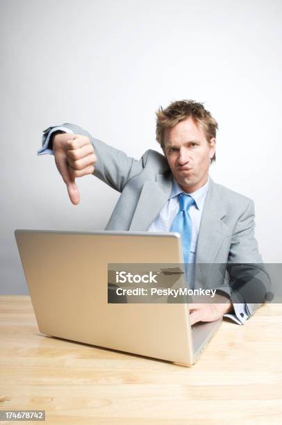 Office Worker Gives A Thumb Down Stock Photo - Download Image Now - Business, Businessman, Computer