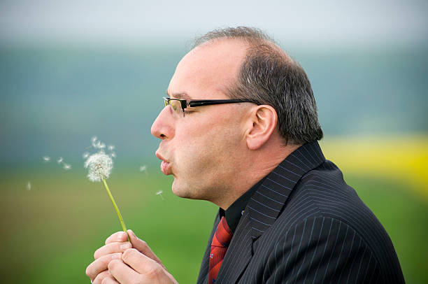 istock Businessman with dandelion 174679340