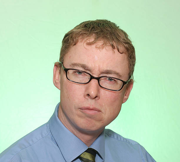 istock Red blonde haired man with glasses portrait 174679429