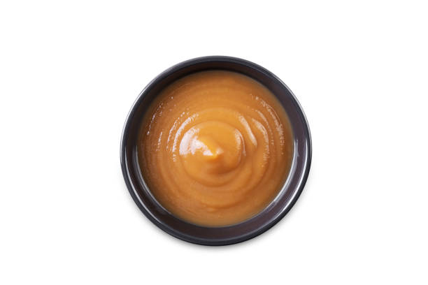 istock Apple puree or butter on a white isolated background 1746798448
