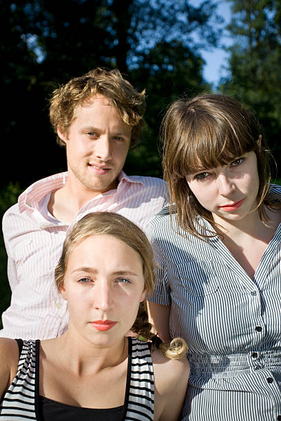 istock Three Happy Good Looking Young Adults in Park 174679917