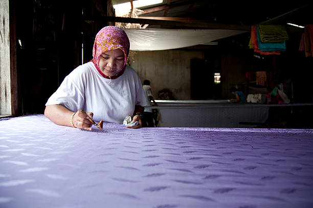 Malaysia, making batik, colorful clothes.  malaysian batik stock pictures, royalty-free photos & images
