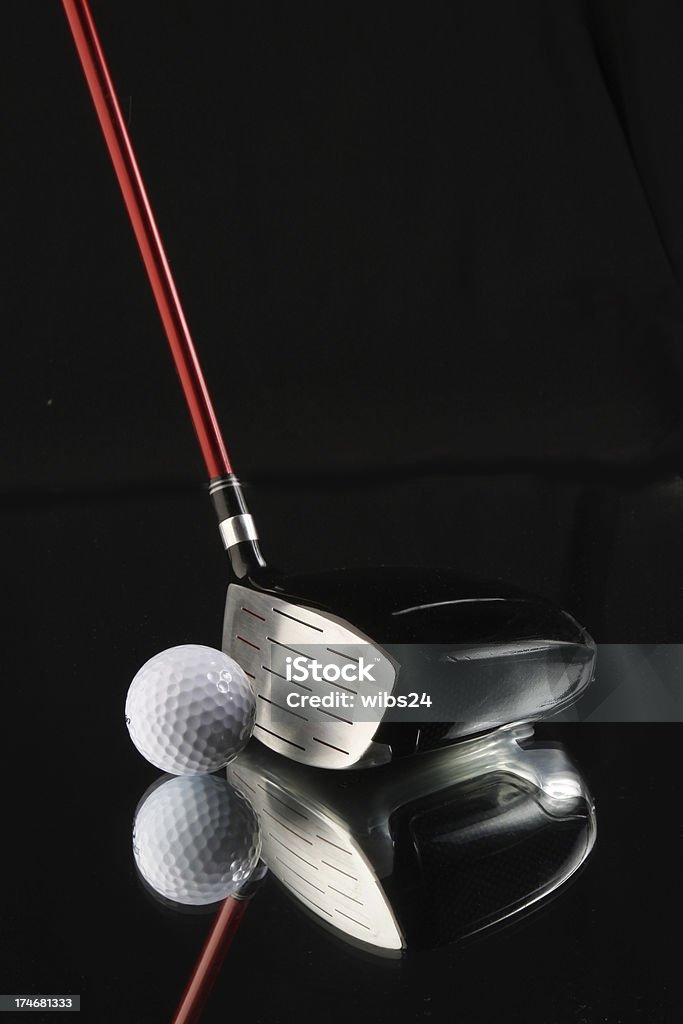 Golf ball and Club A mirrored golf ball and club on a black background.For similar shots click below: Black Background Stock Photo