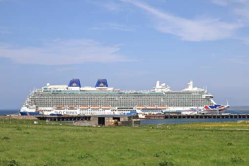 Kirkwall, Scotland - June 18:  P and O cruise ship, Britannia, moored in Kirkwall on June 18, 2023.  Kirkwall is the largest town in Orkney.  The Orkney Islands sit north of the Scottish mainland.