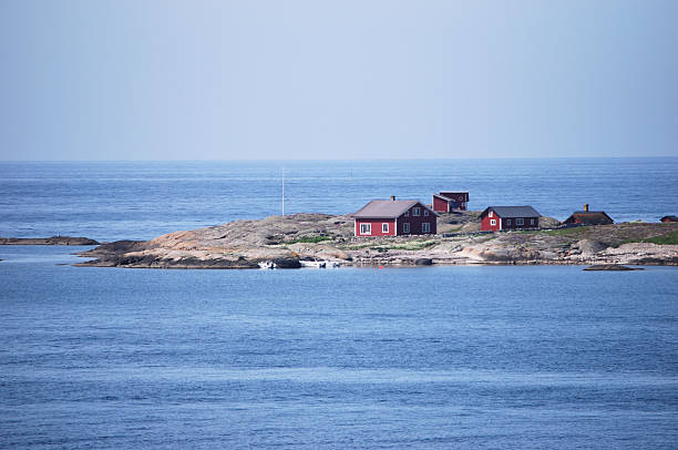 istock Small red houses on island 174682673