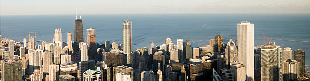 Aerial Panoramic View of Downtown Chicago (XXXL) Aerial panoramic view of downtown Chicago with Lake Michigan beyond. aon center chicago photos stock pictures, royalty-free photos & images