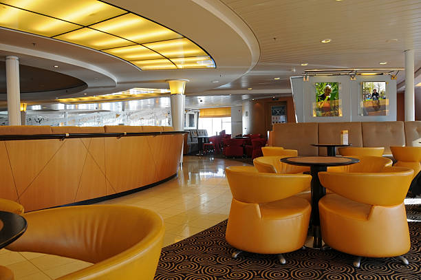 Lounge in ship with bar and brown chairs stock photo
