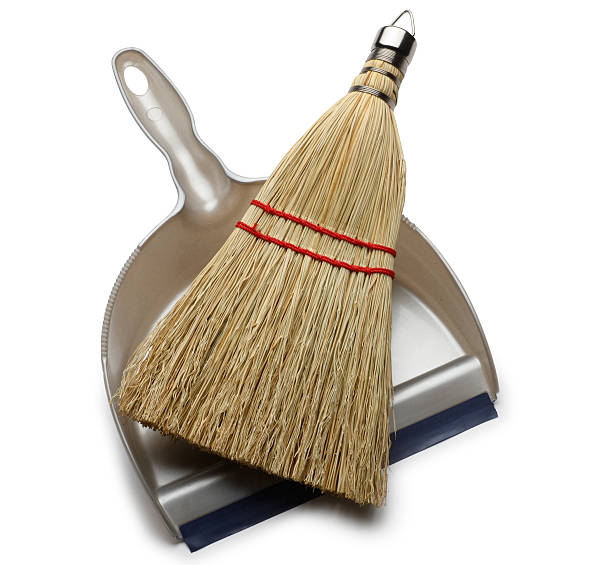 Whisk broom and dustpan on white background
