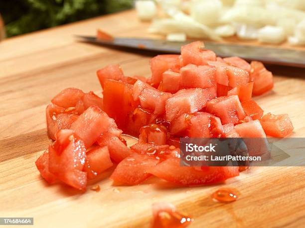 Diced Tomatoes On Cutting Board Stock Photo - Download Image Now - Chopped Food, Tomato, Heap