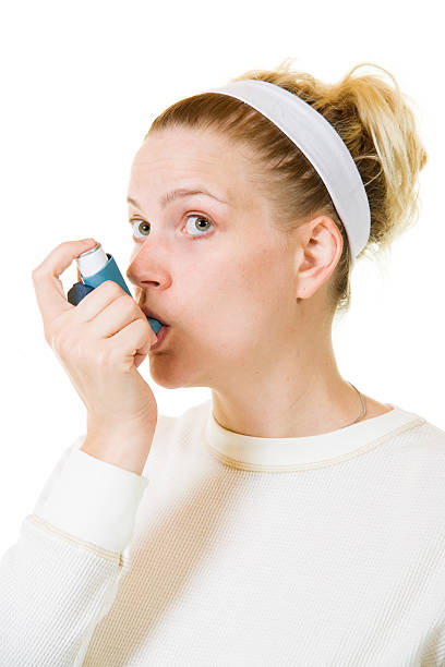 istock Woman Using Inhaler or Puffer for Asthma 174685012