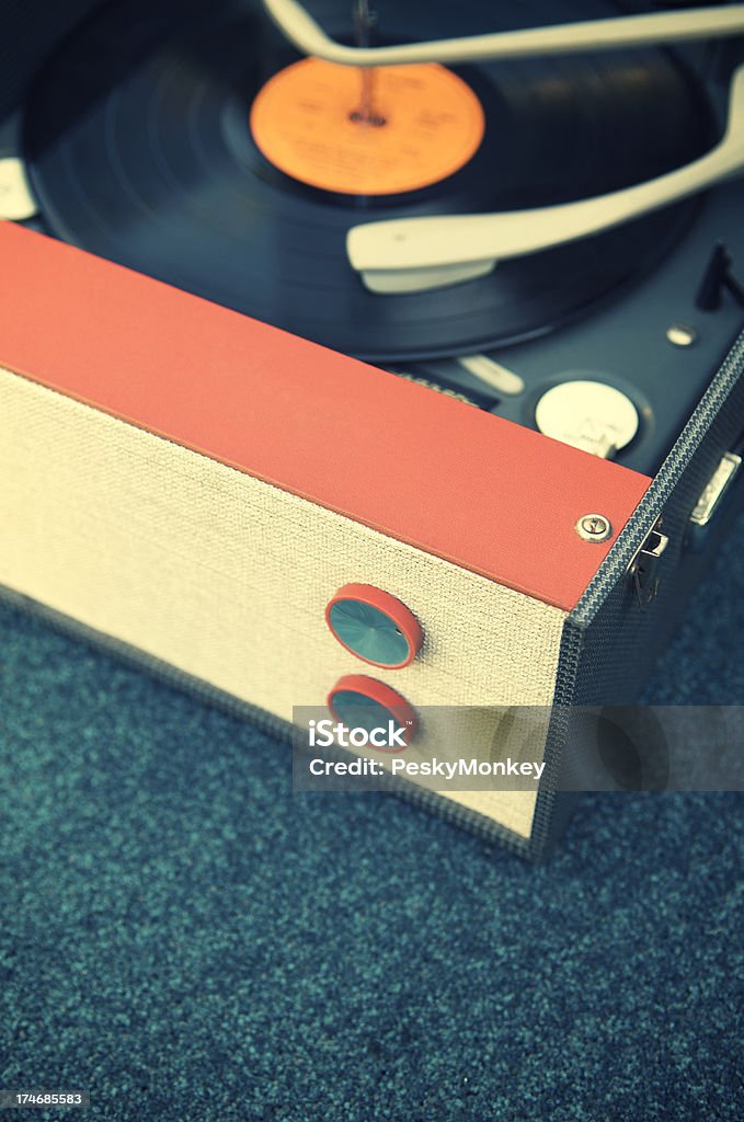 Old Fashioned Record Player Turntable on Blue Old fashioned record player turntable sits on vintage blue background 1950-1959 Stock Photo