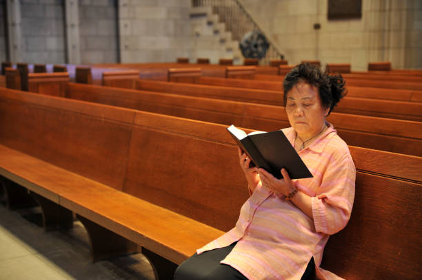 istock Woman Reading Bible 174685635