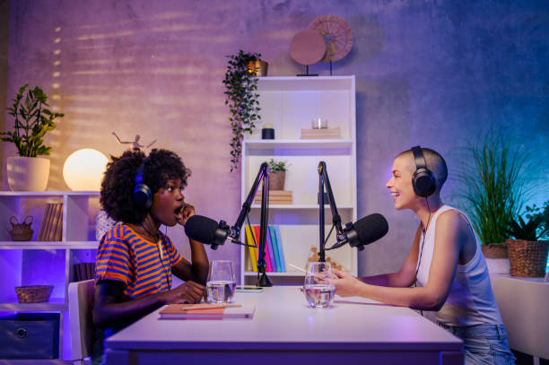istock A shocked african woman is sitting in a podcast studio with a host 1746857075