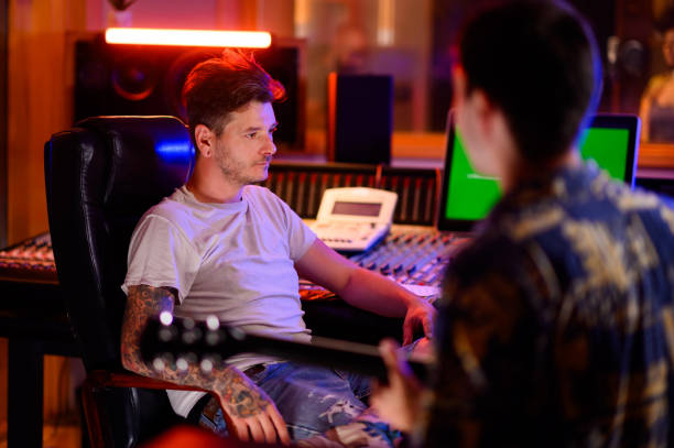 istock Studio musicians recording music in studio. 1746860350