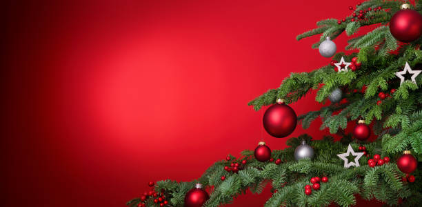Red Christmas background with decorated tree closeup