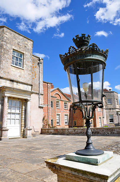 Mottisfont House - Lamp A view of Mottisfont House with a distinctive lamp in the foreground. mottisfont stock pictures, royalty-free photos & images