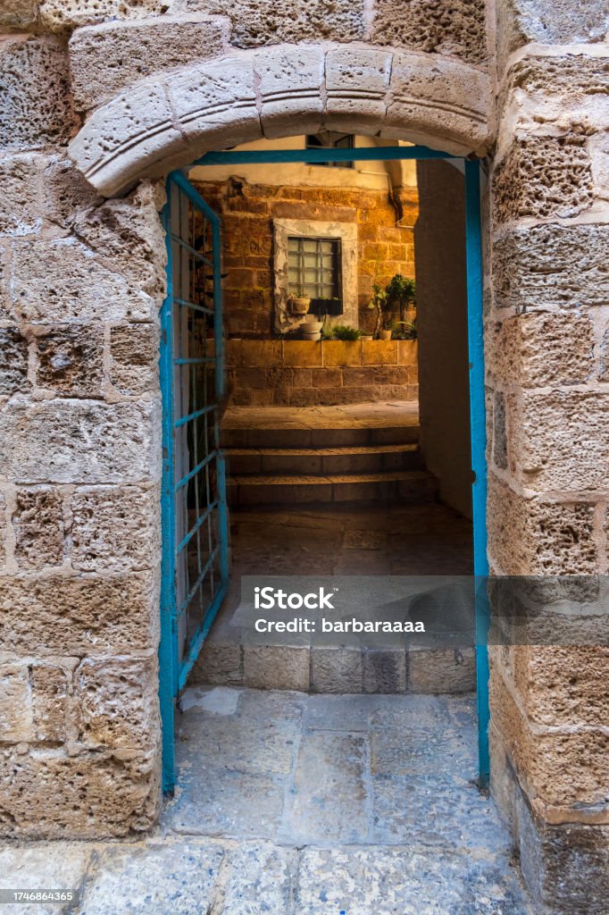 Blue Gate Arched Doorway in Old Jaffa, Israel Alley Stock Photo