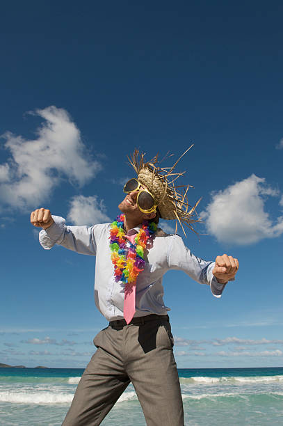 istock Tourist Businessman Gets Funky on the Beach 174686588
