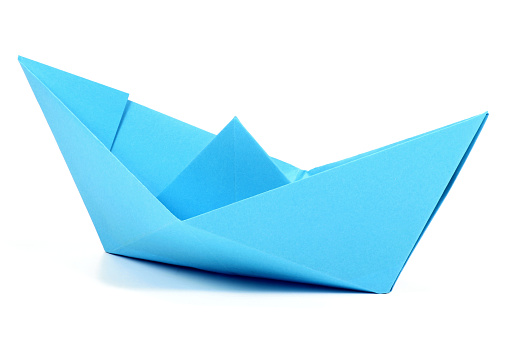 blue paper boat isolated on white background