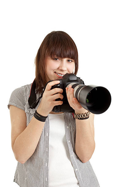 istock teenager girl with digital camera 174686748