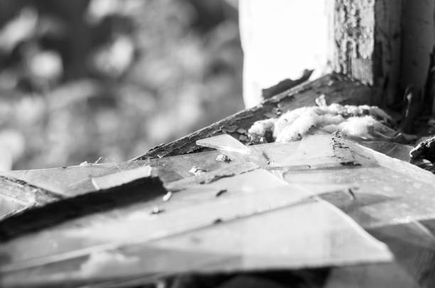 istock Pieces of broken glass on the windowsill 1746871025