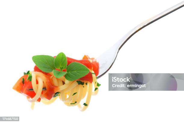 Spaghetti Cherry Tomatoes Parsley And Fresh Oregano On Fork Stock Photo - Download Image Now