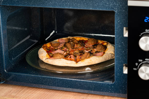 istock reheating pizza in the microwave 1746871595