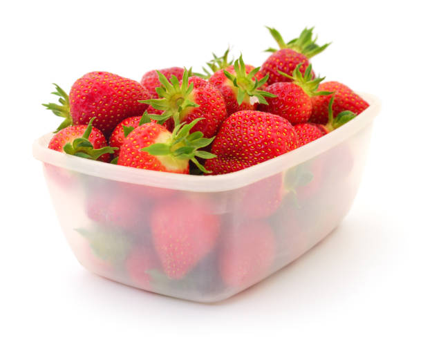 istock Red ripe strawberries in plastic tray container. 1746877645