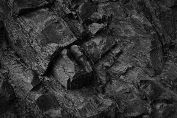 istock Black white rock basalt texture. Rough mountain surface. Close-up. Background for design. 3D shape. 1746885119