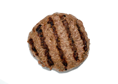 Grilled Hamburger patty isolated on white. Photographed from directly above. Accurate grilled meat color.Please Also See: