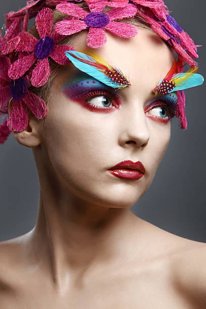 istock portrait with flowers and feathers 174688812