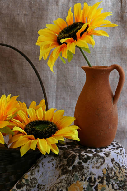 istock artificial sunflower in a old vase on the table 1746889323