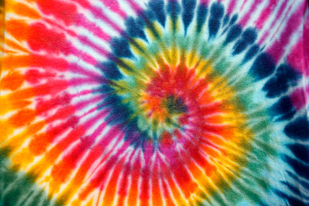 tie dye-strudel - psychedelic funky yellow orange stock-fotos und bilder