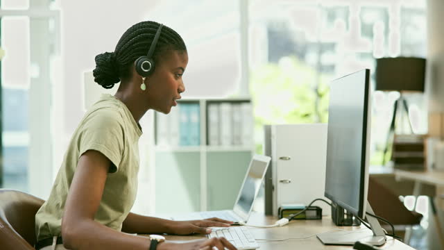Computer, typing and call center consultant in office doing an online consultation with email. Crm, contact and black woman customer service or telemarketing agent working on technology in workplace.