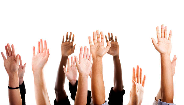 Hands raised Multiethnic raised hands hand raised stock pictures, royalty-free photos & images