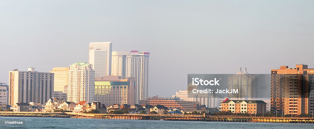 Atlantic City Panoramic At Sunrise "Atlantic City, NJ panoramic cityscape on a hazy, muggy morning at sunrise.2 image merge. All Casino logos and names are removed or blurred." Beach Stock Photo