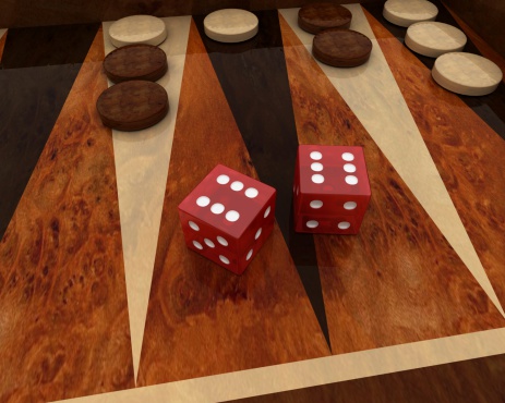Two red semi transparent dice in a game of backgammon. Dice displaying double six